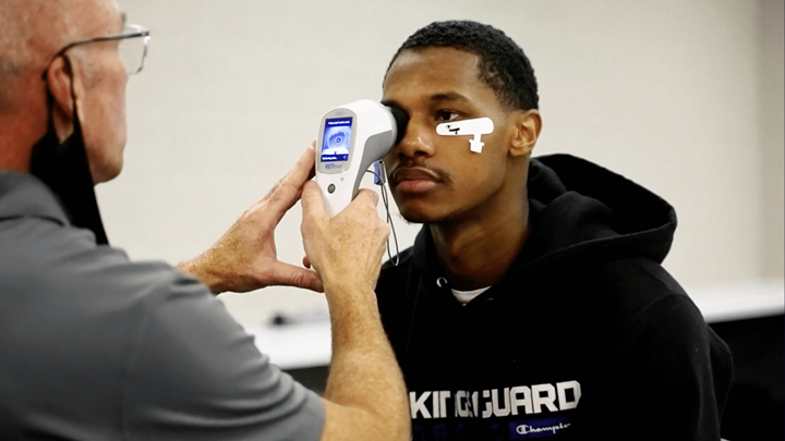 A Kings Guard player receives performance vision training. 