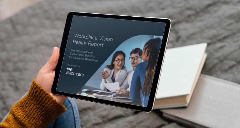 Women and man looking at report on tablet